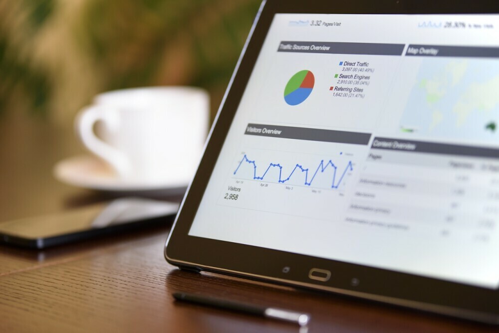 a tablet with analytics on the screen